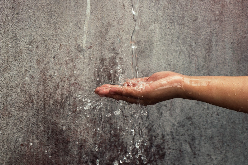 Water falling on a hand